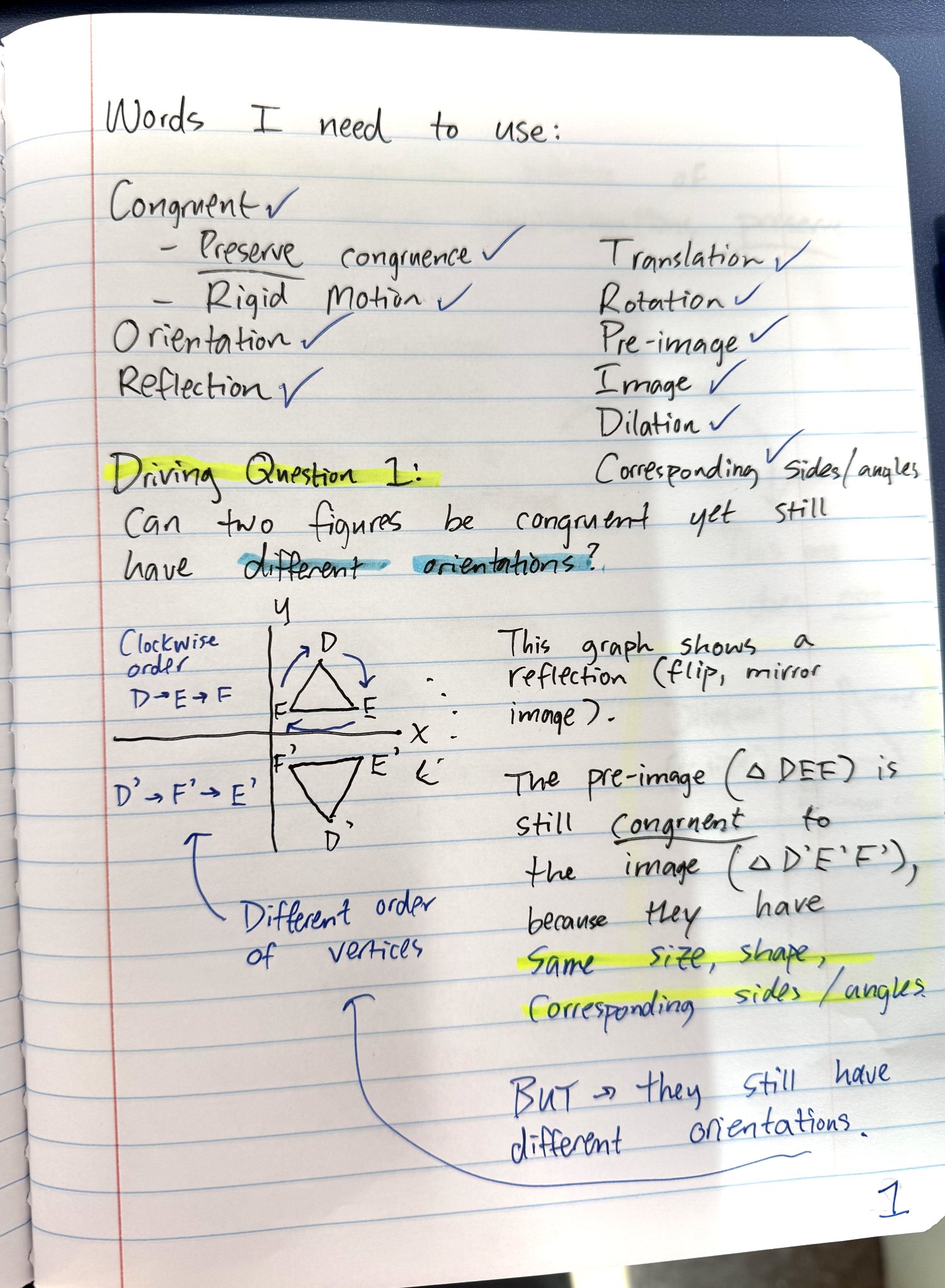 Handwritten notebook page: vocabulary checklist, Driving Question 1 on congruence and orientation, and a graphed reflection of triangle DEF